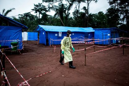 A health care worker helping Ebola patients in 2017.