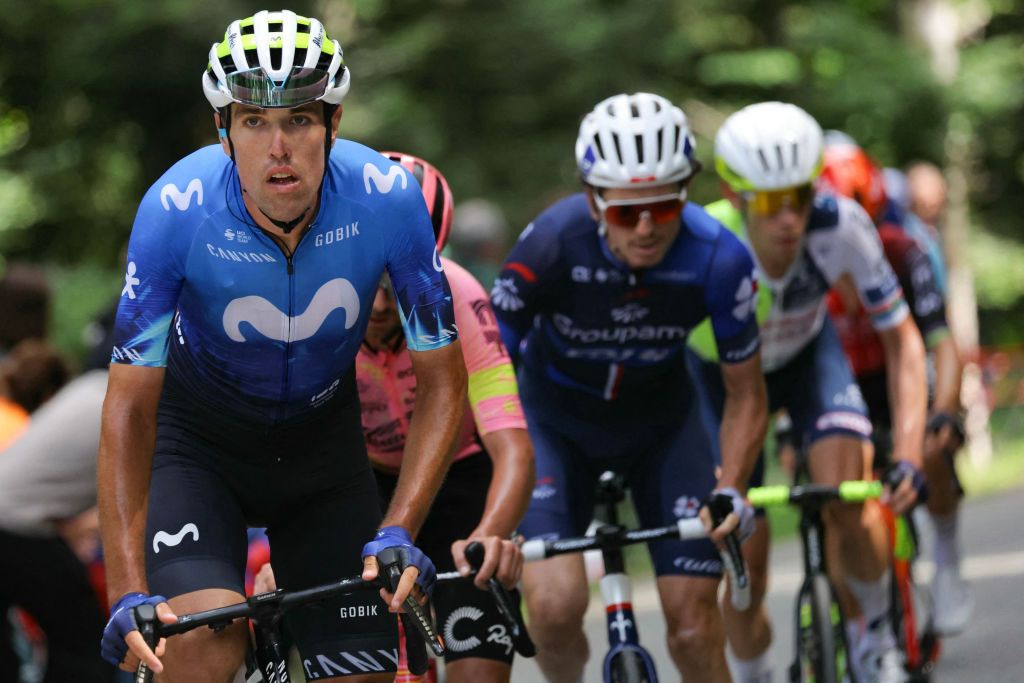 Movistar Team's Basque rider Oier Lazkano (L) cycles ahead of Groupama - FDJ team's French rider David Gaudu in a breakaway during the 14th stage of the 111th edition of the Tour de France cycling race, 151,9 km between Pau and Saint-Lary-Soulan Pla d'Adet, in the Pyrenees mountains in southwestern France, on July 13, 2024. (Photo by Thomas SAMSON / AFP)