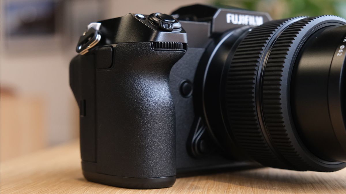 The Fujifilm GFX50S II on a wooden table