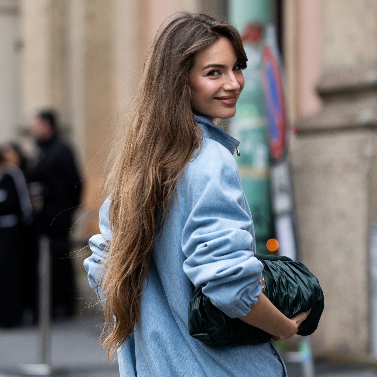 street style shot of woman with long brunette hair