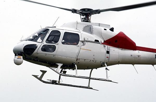 Gianni Bugno pilots the helicopter.