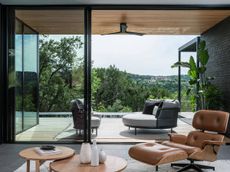 A backyard with bi-folding doors opened for spring