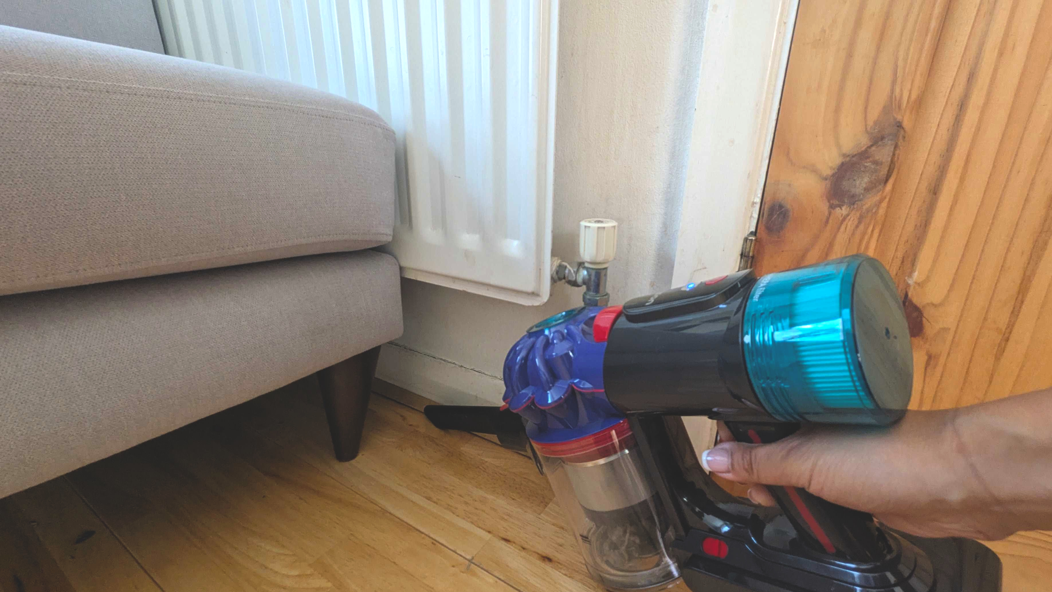 Cleaning edges of room with crevice tool