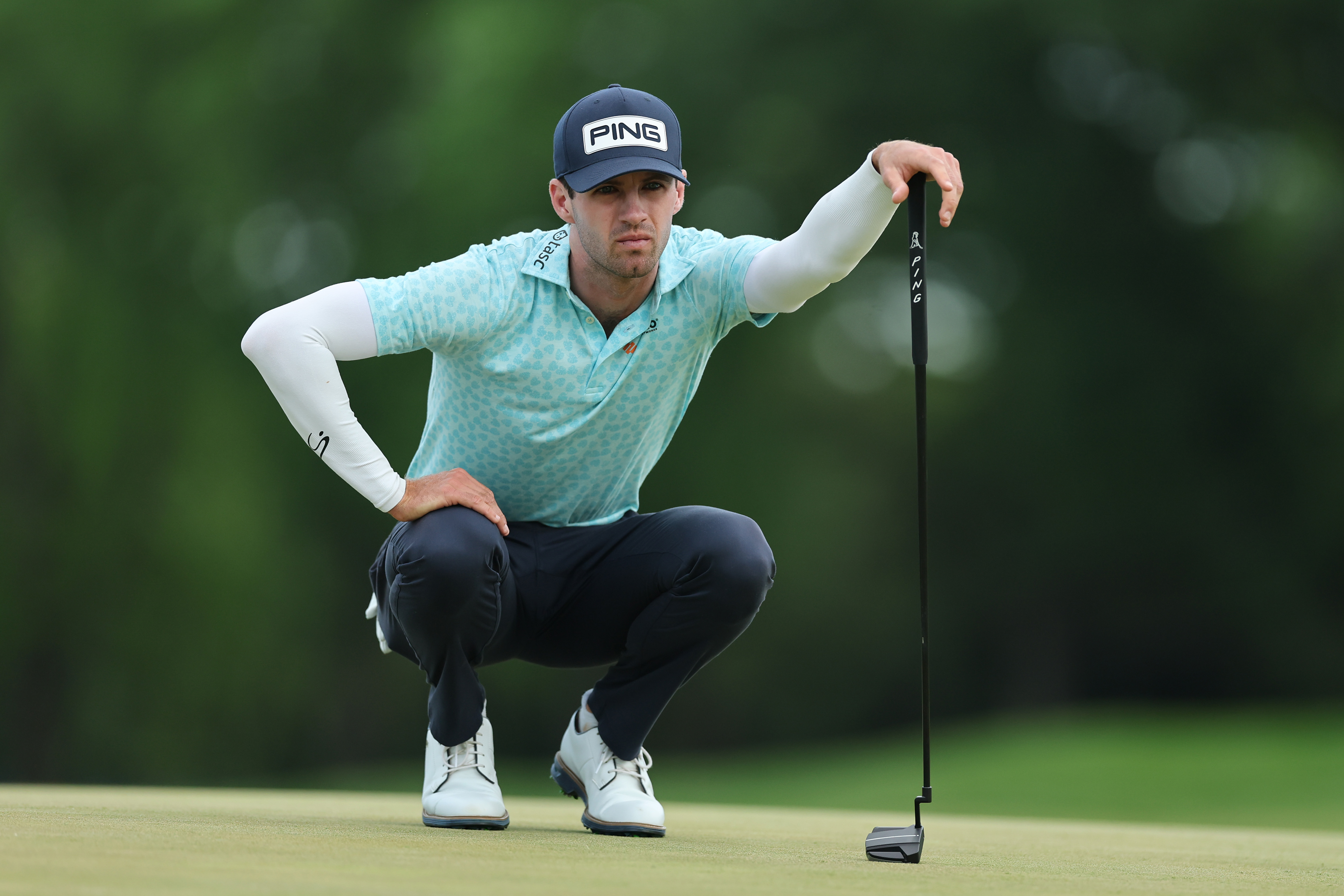 Alex Smalley looks over a putt on the 13th hole during the third round of the PGA Championship at Aronimink Golf Club