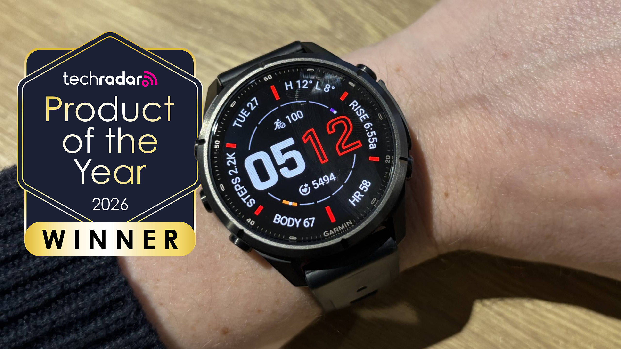 Garmin Fenix 9 Pro on a man's wrist, with a logo saying "TechRadar Product of the Year winner 2026"