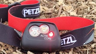 petzl headlamp on bark backdrop