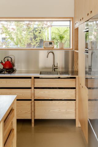 The slot window above the kitchen counter