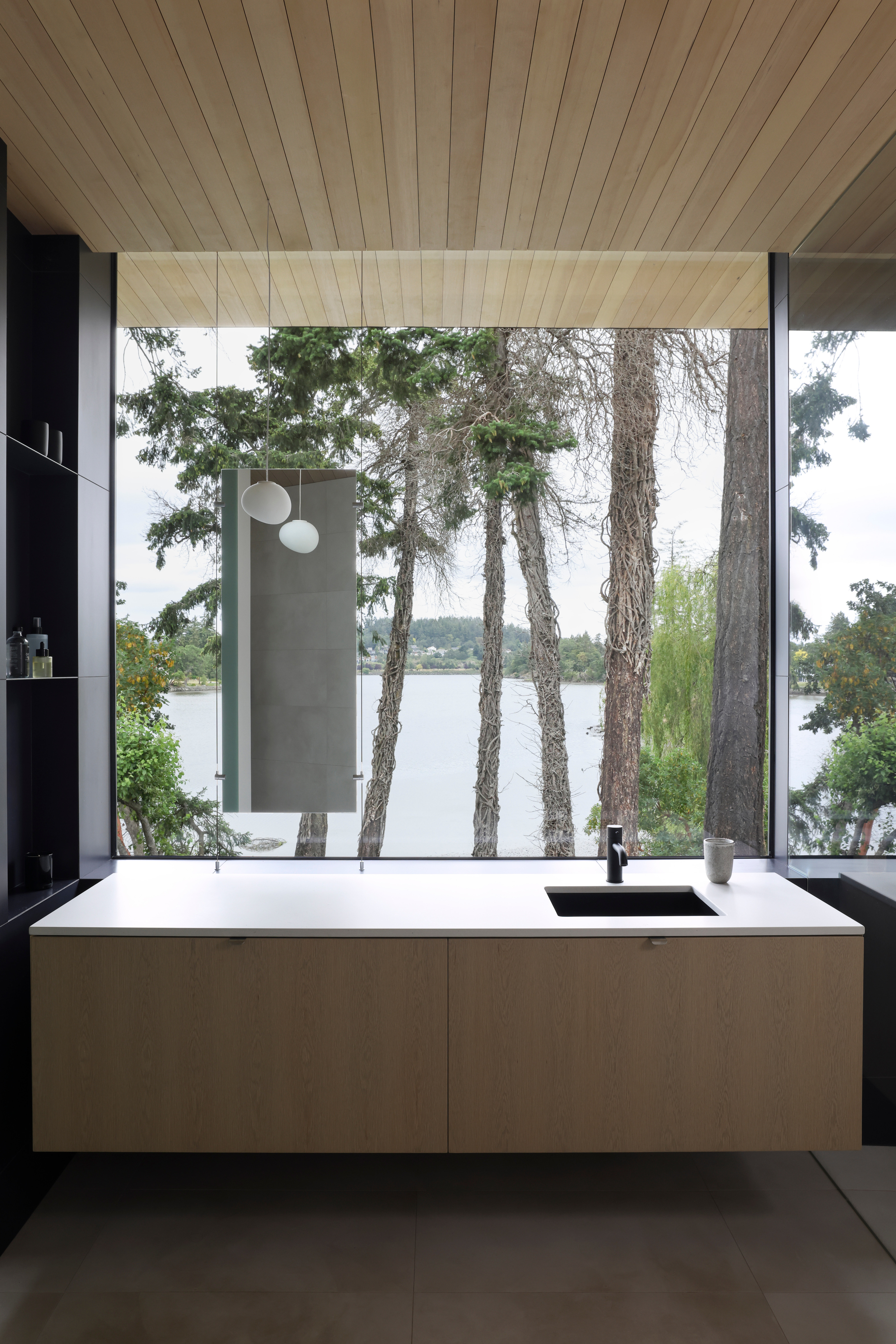 The primary ensuite frames spectacular lake views