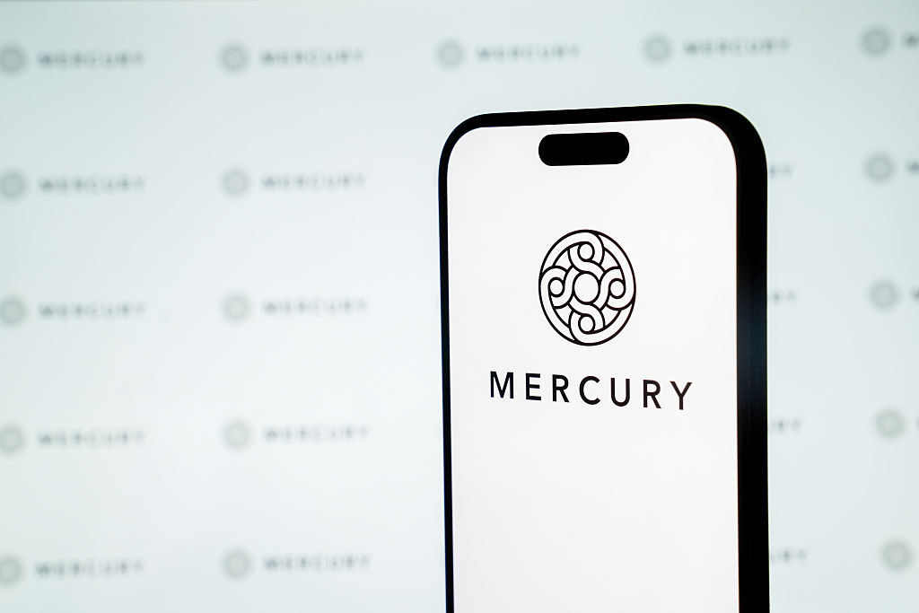 The Mercury logo on a smartphone.