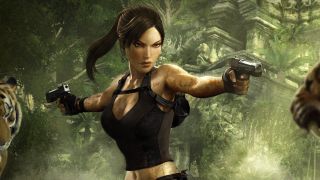 Lara Croft from Tomb Raider: Underworld stares down a pair of tigers with pistols drawn.