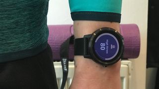 Person's wrist with Garmin Vivoactive 3 displaying stress levels