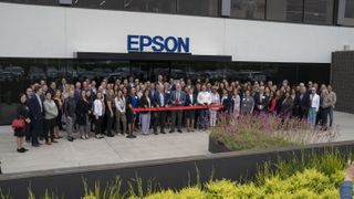 The Epson team stands in front of the new Los Alamitos HQ to cut the ribbon.