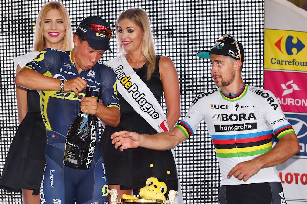 Peter Sagan helps Caleb Ewan with the champagne at Tour of Poland