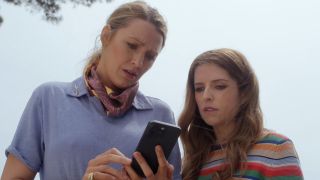 Blake Lively and Anna Kendrick look at a phone with faces of worry in Another Simple Favor.
