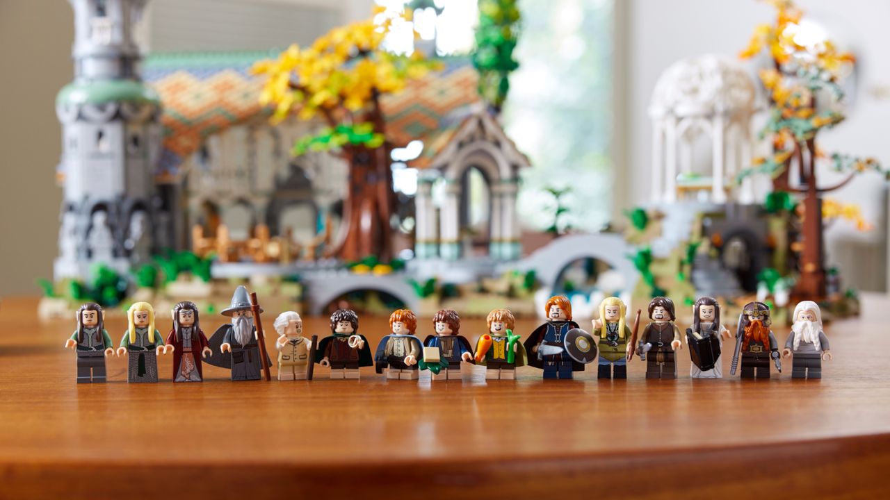 LEGO The Lord of the Rings Rivendell set minifigures laid out in a line, with the main Rivendell building in the background