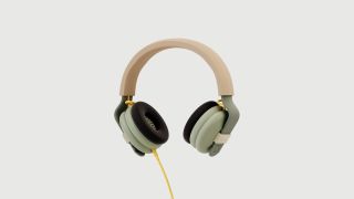 Kibu headphones on beige background