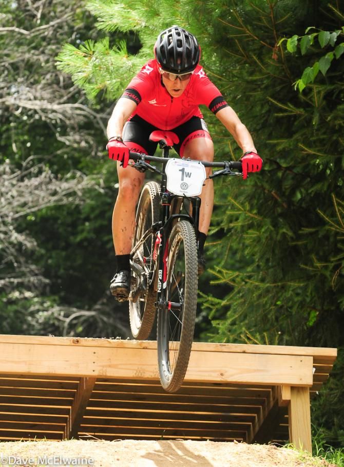 Lea Davison (Specialized) coming off a jump on lap one