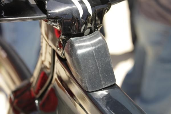The rubber cover is meant to keep excessive water and grit out of the frame, but moves easily when steering the bike.