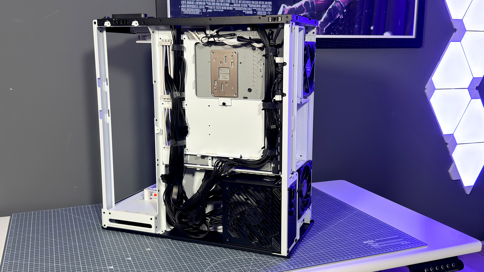The Havn HS 360 PC case in black and white on a desk.
