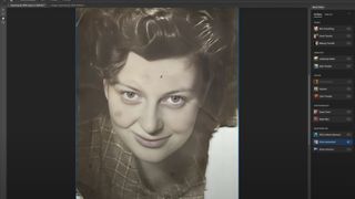 An old photo of a woman's face being restored in Photoshop