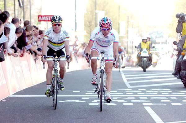 Cadel Evans and Serguei Ivanov come across a dozen seconds down.