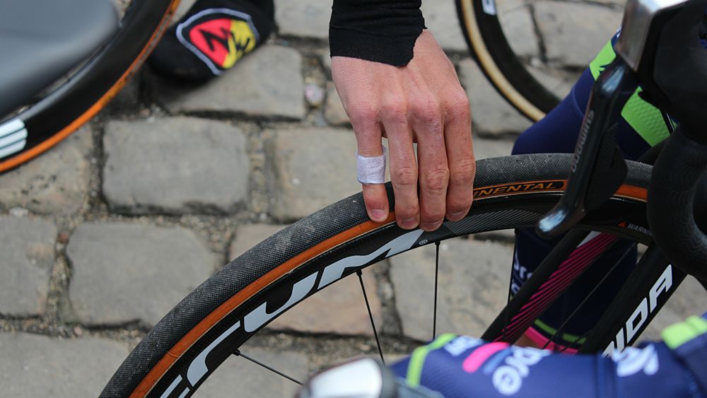 Mechanics use electric pumps and digital gauges; riders use their thumbs