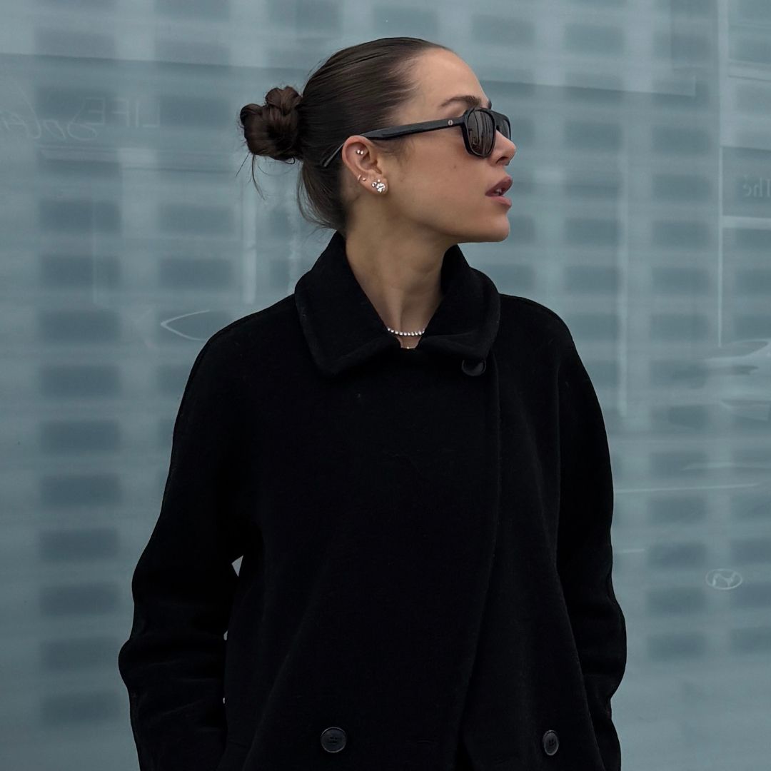 Kira Mackenzie Jackson wearing a black Max Mara coat and pants