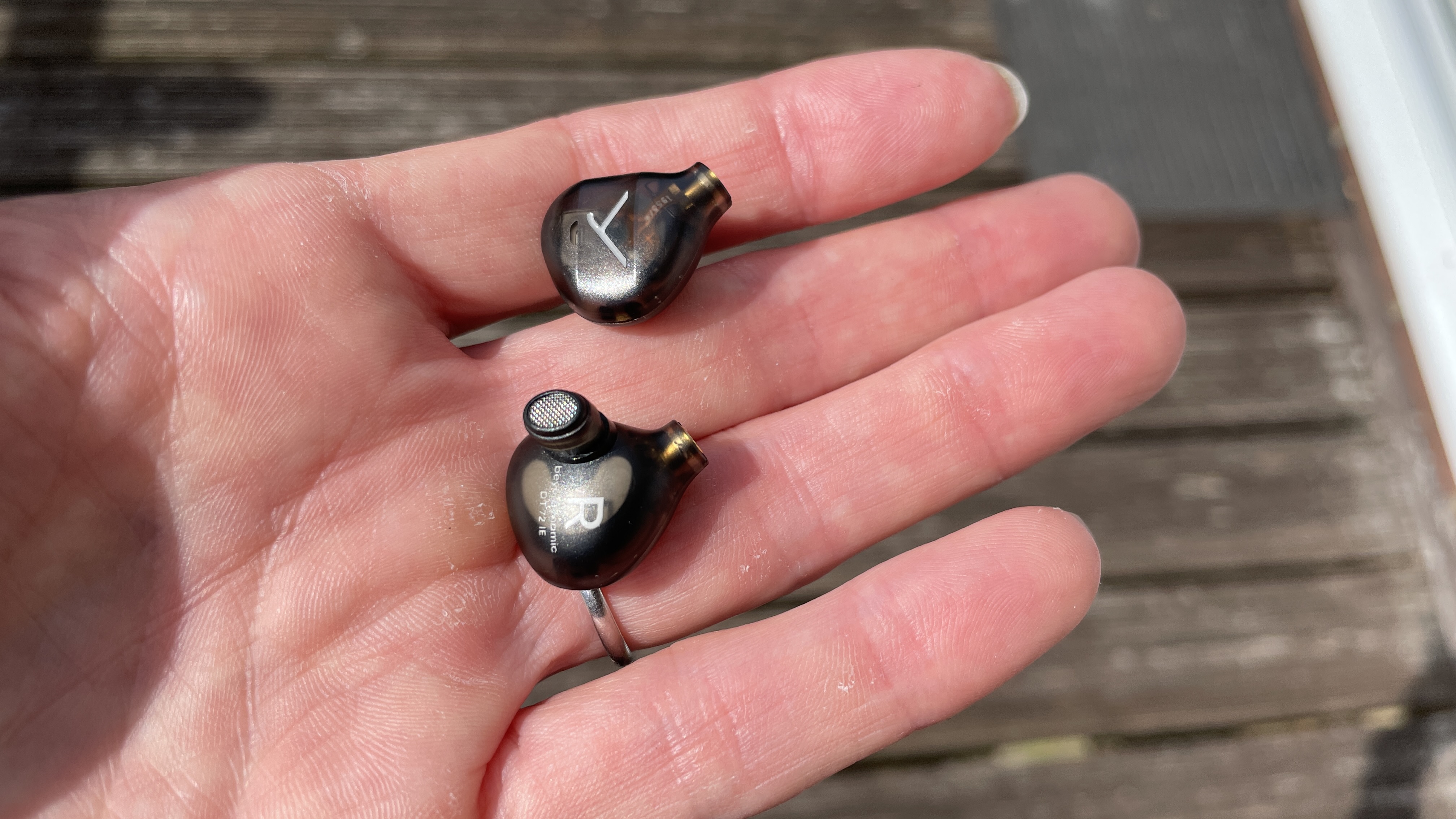 Beyerdynamic&#039;s DT 72 IE earbuds for vocals and guitar on brown background, showcasing the accessories 