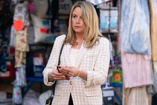 Sam Mitchell gets a surprise phone call in EastEnders
