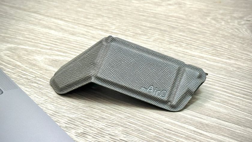A foldable myAir.0 OriMouse on a desk in titanium grey
