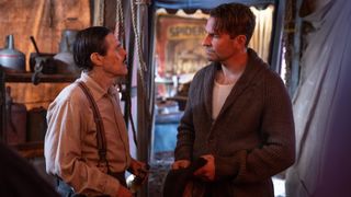 Willem Dafoe and Bradley Cooper in Nightmare Alley