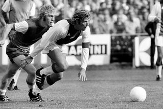 Wim Rijsbergen of Feyenoord and Piet Keizer of Ajax compete for the ball in a Dutch league match in 1973.