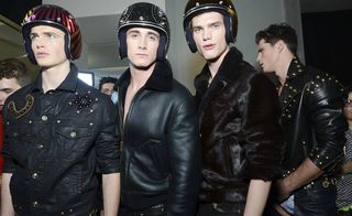 Male models in biker jacket and helmet