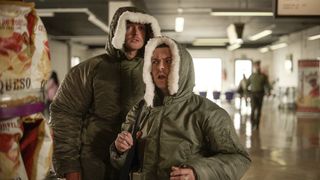 Jock and Conor dressed in coats stuffed with drugs at the airport before their arrest.