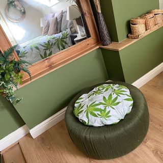 upcycled tyre stool with green wall and mirror wall