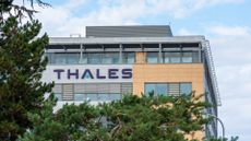 Exterior of an office building with the Thales logo on its side