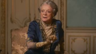 Dame Maggie Smith rises from her chair in Downton Abbey: A New Era.