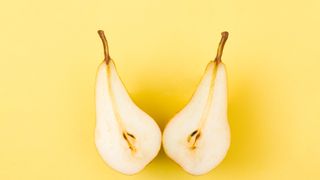 open pear on yellow background