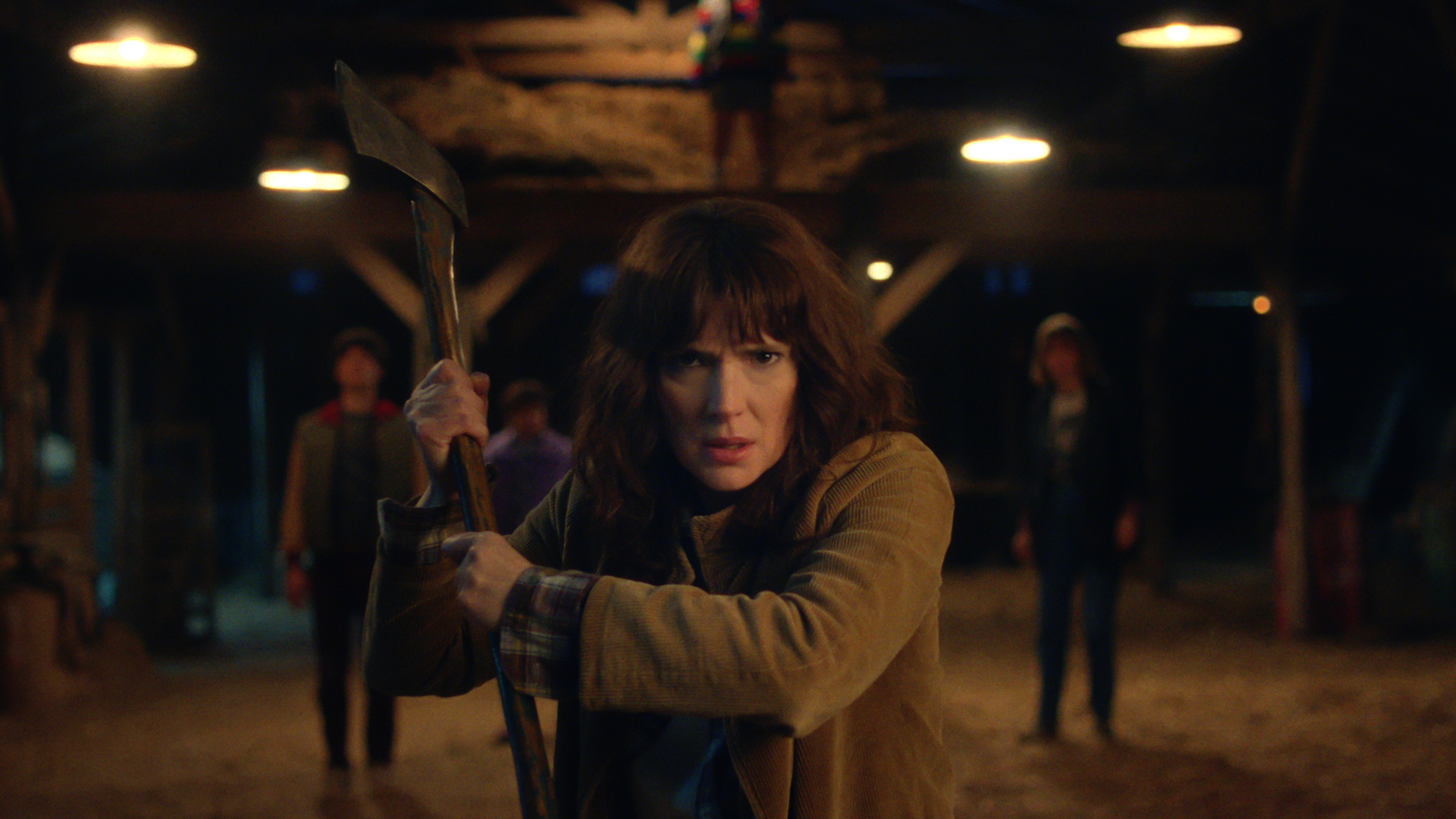 Joyce Byers (Winona Ryder) brandishes an axe in a scene from "Stranger Things" season 5