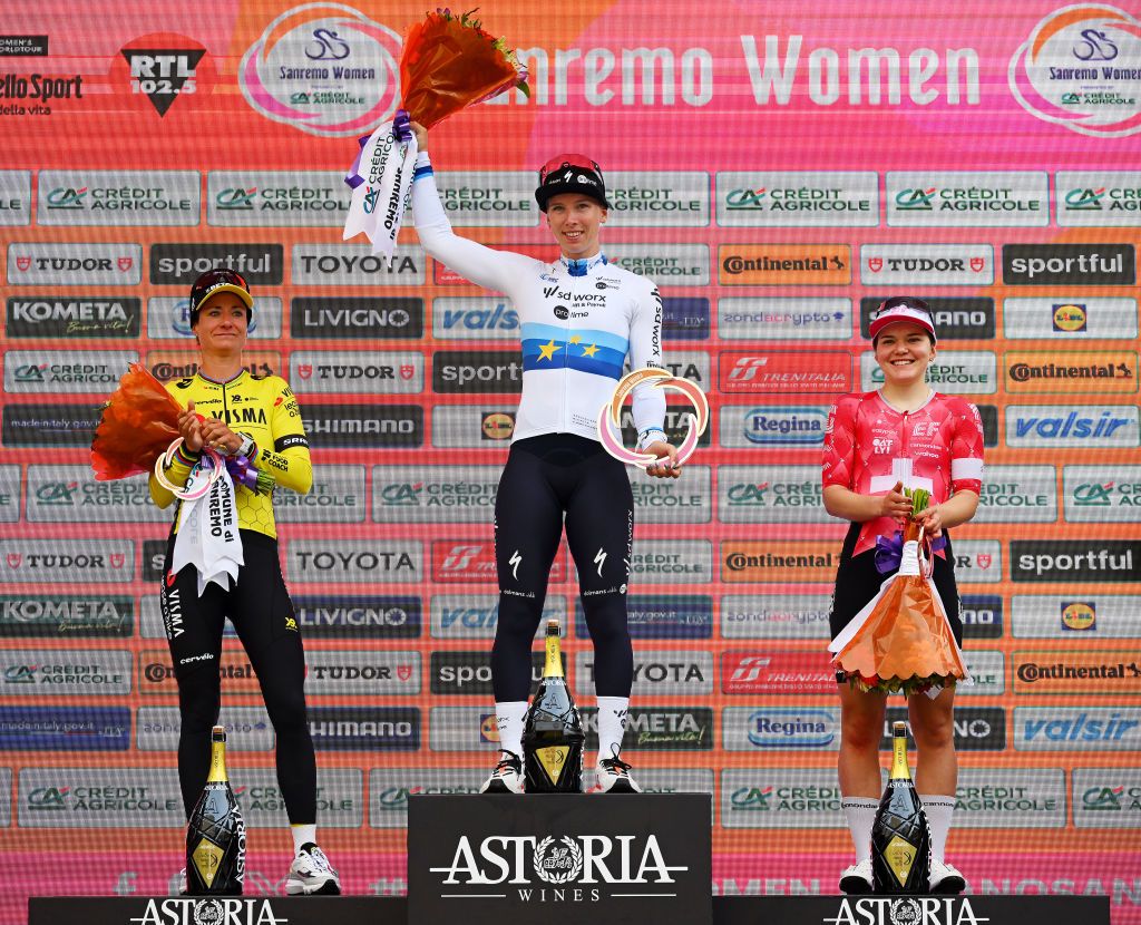 SANREMO ITALY MARCH 22 LR Marianne Vos of Netherlands and Team Visma Lease a Bike on second place race winner Lorena Wiebes of Netherlands and Team SD Worx Protime and Noemi Ruegg of Switzerland and Team EF EducationOatly on third place pose on the podium ceremony after the 1st Sanremo Women 2025 a 156km one day race from Genova to Sanremo UCIWWT on March 22 2025 in Sanremo Italy Photo by Tim de WaeleGetty Images