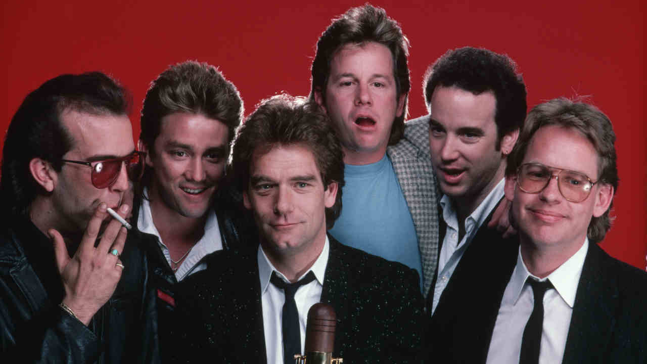 Huey Lewis &amp;amp; The News posing for a photograph in 1985