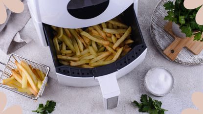 Air fryer on a white marble kitchen counter to show how to use an air fryer