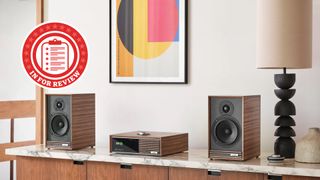 Ruark Audio Sabre-R speakers next to the Ruark R610 streaming system