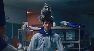 Harry Shum Jr as Raccoonie in Everything Everywhere All At Once