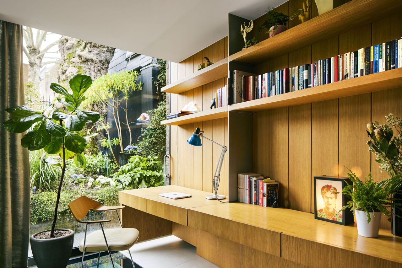 Douglas Fir wooden cabinets are used in the office, which looks out onto the tropical garden