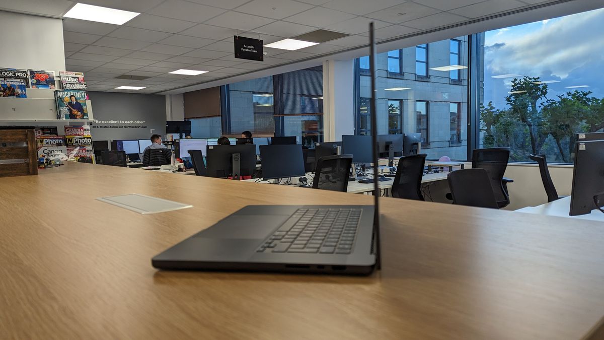 MacBook Pro 16-inch with screen open in an office