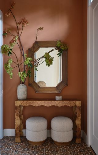 Warm umber entryway with console table.