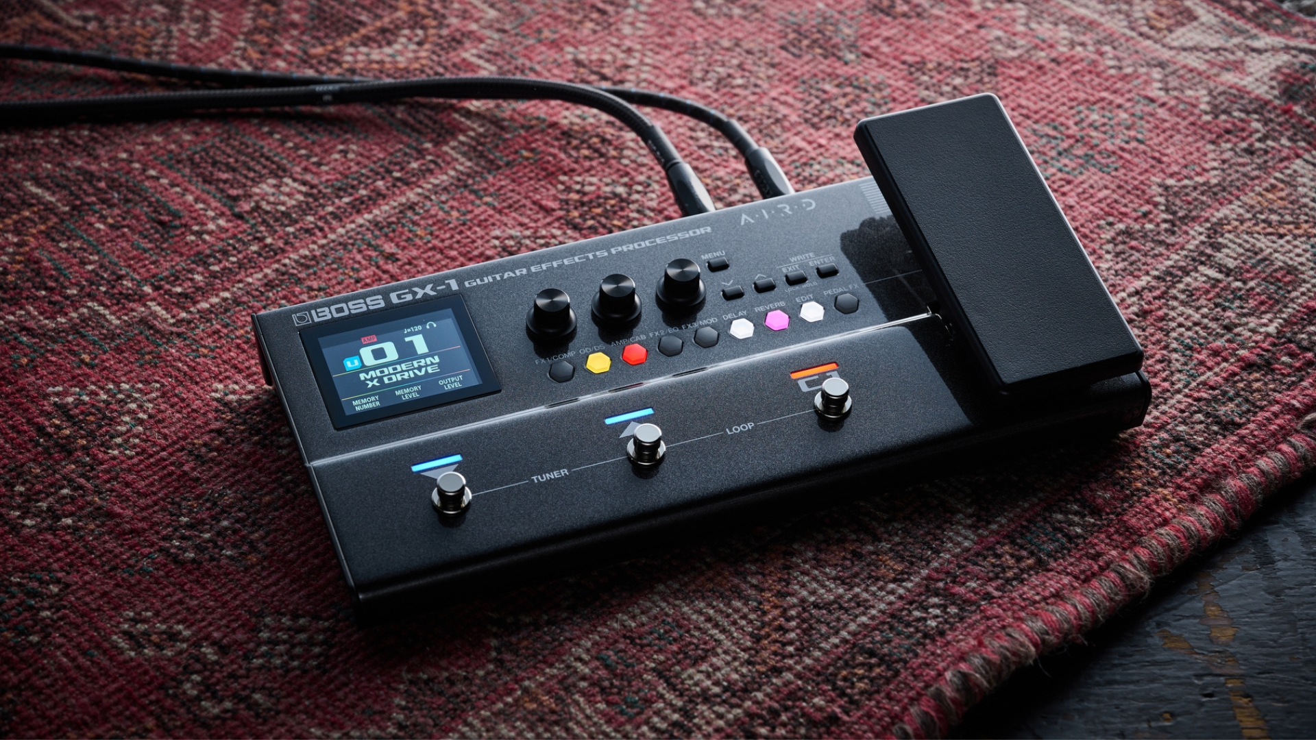 A Boss GX-1 multi-effects pedal on a rug