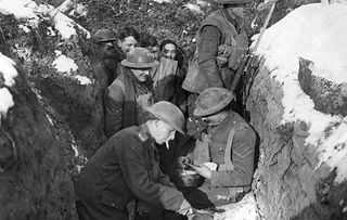 Great War. WW1 bread is served to troops in a front line trench