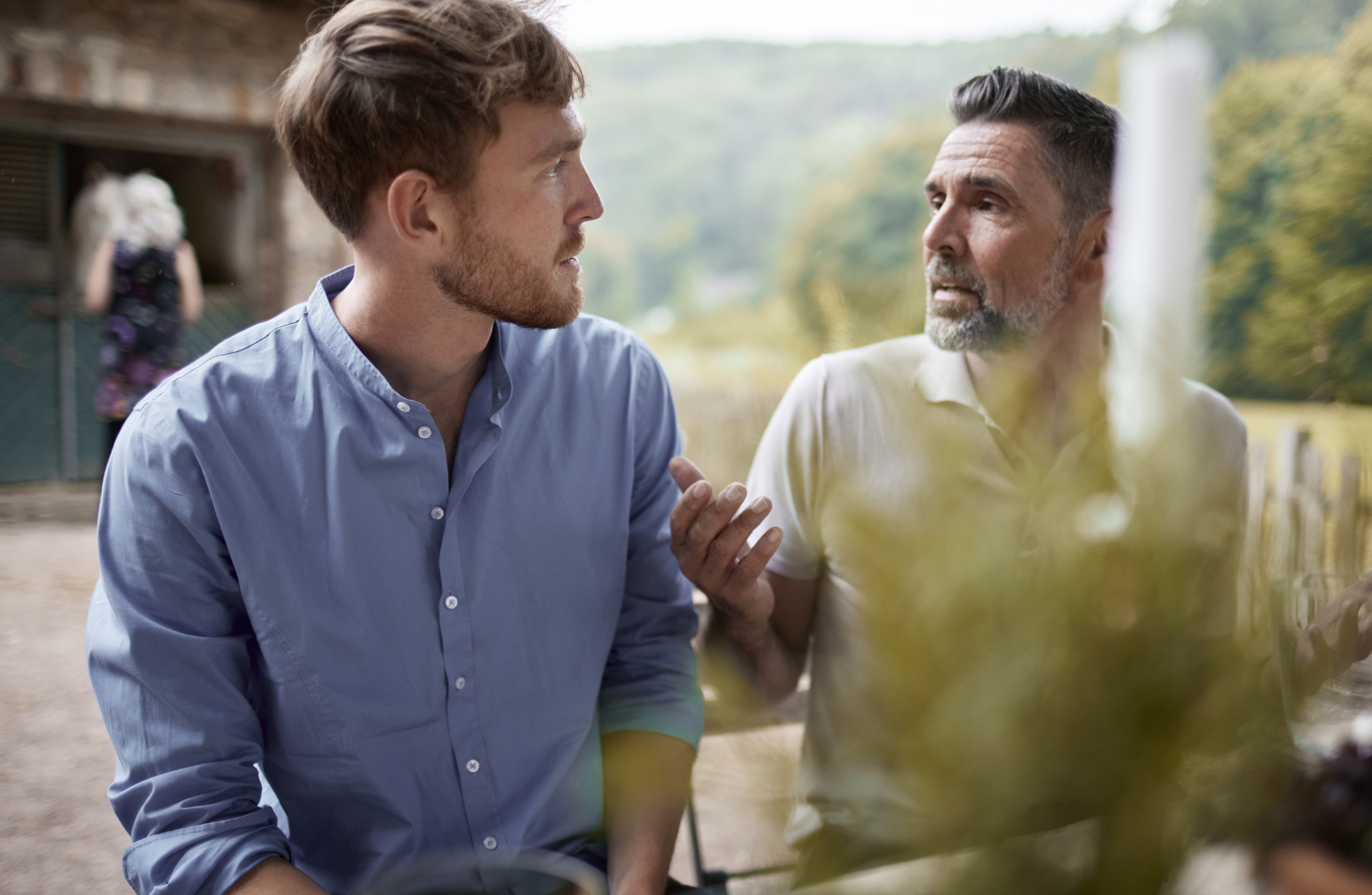 Dad talking to son outside